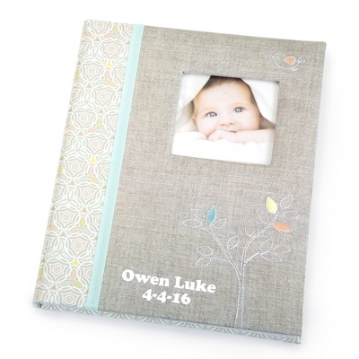 Our personalized Linen Embroidered Tree Baby Photo Album is covered with grey linen, accented with real stitching and clean minimalistic characters to provide a homespun charm. Included is 64 beautifully decorated pages to record memories and milestones of baby's first 5 years. Personalize this gift with a name or special message on the bottom left. -11.8" x 9." x 1." -Acid-free and lignin-free paper -Great personalized gift for a new mother, baby shower. Linen Embroidered Baby Memory Book, In Grey, Stone, By Things Remembered.