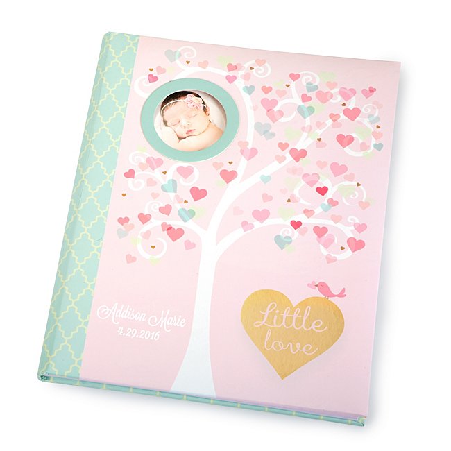 Our personalized Little Love Baby Memory Book will record memories and milestones of baby's first 5 years. Throughout 64 beautifully illustrated pages, sections include family tree and space for pictures. The cover is adorned with a photo frame for a picture of the baby. Personalize this gift with a name or special message on the bottom left. -11.8" x 9" x 1." -Acid-free and lignin-free paper -Great personalized gift for a new mother, baby shower. Little Love Baby Memory Book, In Blue, Stone/Gold, By Things Remembered.
