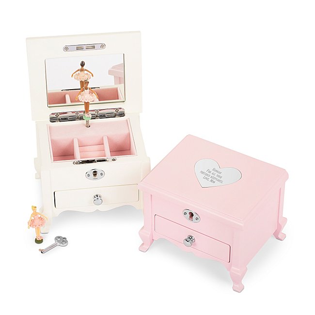 Our personalized Girl's Footed Musical Jewelry Box is the perfect gift for the special little girl in your life. With plenty of space for jewelry and keepsakes, this jewelry box will be there for her for years to come. Wind up the key on the back of the box to ready a song for the ballerina to dance to when you open the box. Engrave the heart-shaped engraving plate on the top with that special girls name. - W: 5.94 inches x L: 5 inches x H: 4.63 inches - Key and lock included - Great personalized gift for daughter, niece, granddaughter, birthday or just because ". Girls Footed Musical Jewelry Box, Wood/Velvet, By Things Remembered.
