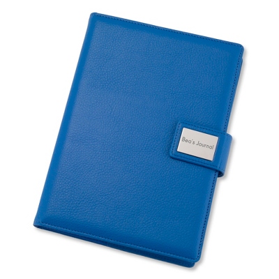 Stay on top of notes, lists and everything worth writing down with our personalized Medium Blue Pebble Grain Journal. Solid and sleek, the leatherette journal is filled with 120 sheets of lined paper for all your jotting needs. Engrave a monogram, date or job role on the front plate for a bonus personal touch. -Size: 6.5" W x 8.7" H x 1.4" D -Material: Leatherette, Paper -Inspiration: A great gift for a recent graduate, new coworker or friend. Medium Blue Pebble Grain Journal, By Things Remembered.