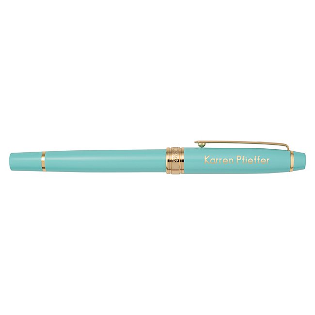 Whether looking to impress the boss or just finding a new, reliable writing tool our personalized Aqua Reflections Rollerball Pen is just the thing to tie your desk together. A durable brass design features gold accents against an aqua shell. Add a name, monogram or job role on the pen for an extra personal touch. -Pen Size: 5.125" L x 0.6" W x 0.3" H -Box Size: 7.3" W x 1.2" H x 3" D -Material: Brass -Inspiration: A great gift for a new coworker, a recent graduate or just for yourself. Aqua Reflections Rollerball Pen, In Gold, By Things Remembered.