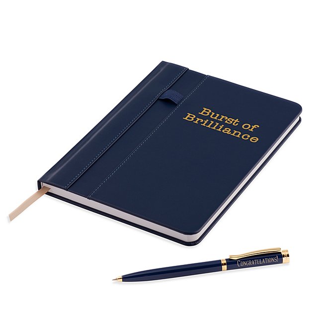 The Brilliance Journal and Pen Set is a complete daily writing set that offers a bit of fun in the professional space. The deep navy journal features the words "Burst of Brilliance" to inspire more writing and comes with an elastic band on the front to hold the included ballpoint pen. Inside the journal is 64 lined pages of paper. Engrave the pen with a name, date, job role or company name. -Contents: Includes journal with 64-lined pages and pen -Size: 5.9" W x 8.06" H x 0.5" D -Material: Leatherette, Paper, Brass -Inspiration: A great graduation, new-job, promotion or congratulatory gift. Burst Of Brilliance Journal And Pen Set, In Navy, By Things Remembered.